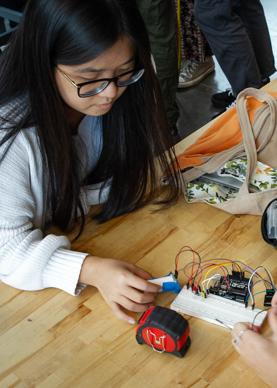 A CEE student working on a sensing project